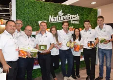The team of NatureFresh Farms proudly shows a wide selection of products.